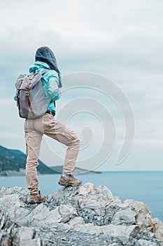 Hiker standing on cliff