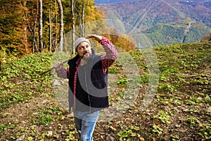 Hiker standing in front of a majestic mountain landscape