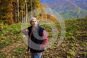 Hiker standing in front of a majestic mountain landscape