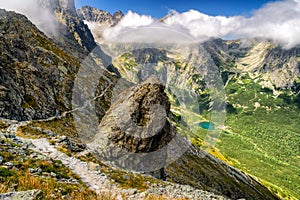 Hiker standing on the hill and looking on mountains