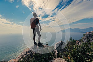 Hiker standing on mountain peak