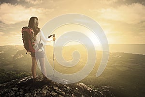 Hiker with stick on mountain