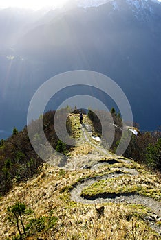 Hiker in Swiss Alps mountains