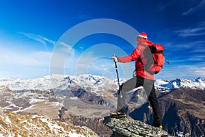 Hiker takes a rest admiring the mountain landscape. Monte Rosa M