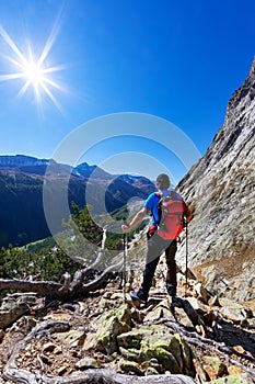 Hiker takes a rest observing a mountain panorama. Mont Blanc Mas