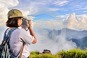 Hiker teens girl taking picture