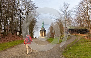 A hiker in the Teutoburg Forest. He reaches the famous Hermann monument.
