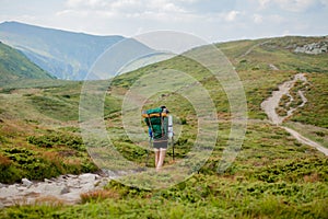 Hiker on the top in Carpathians mountains. Travel sport lifestyle concept