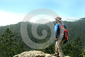 Hiker on Top of a Peak