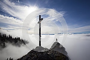 Hiker on top to summit Taubenstein mountain, Bavaria