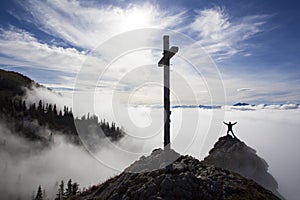 Hiker on top to summit Taubenstein mountain, Bavaria