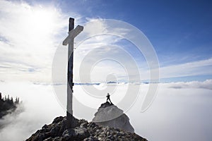 Hiker on top to summit Taubenstein mountain, Bavaria