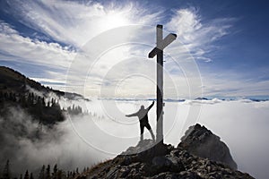 Hiker on top to summit Taubenstein mountain, Bavaria