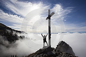 Hiker on top to summit Taubenstein mountain, Bavaria