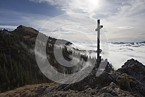 Hiker on top to summit Taubenstein mountain, Bavaria