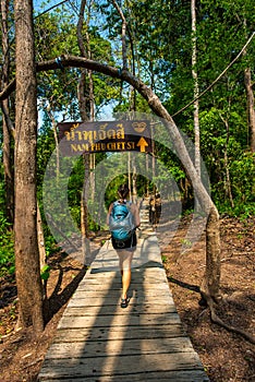 Hiker on a trail to Bua Tong Spring,  Nam Phu Chet Si,.Thailand