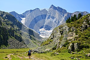 Hiker on a trek in the national park Pyrenees.Occitanie in south of France. photo