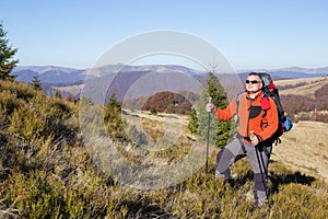 Hiker trekking in the mountains. Sport and active life.