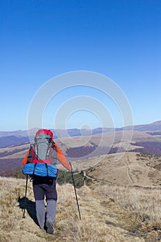 Hiker trekking in the mountains. Sport and active life.