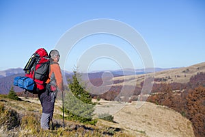 Hiker trekking in the mountains. Sport and active life.