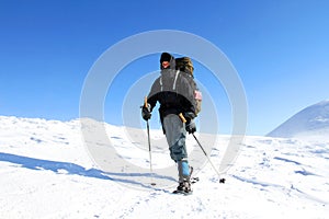 Hiker trekking in the mountains. Sport and active life.