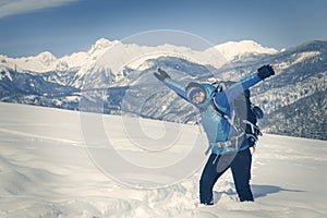 A Hiker trekking in winter landscape.