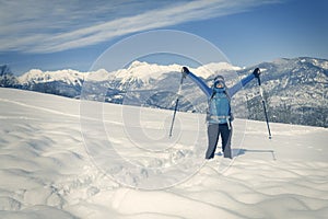 A Hiker trekking in winter landscape.