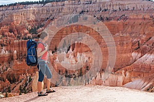Hiker visits Bryce canyon National park in Utah, USA photo