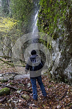 Hiker and waterfall