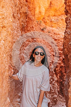 Hiker woman in beautiful nature landscape with hoodoos, pinnacles and spires rock formations. Bryce Canyon National Park