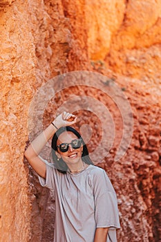 Hiker woman enjoying view in beautiful nature landscape with hoodoos, pinnacles and spires rock formations in Bryce