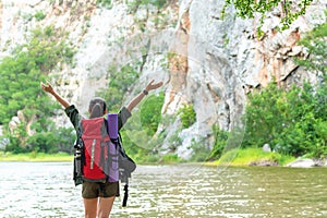 Hiker woman happy feeling freedom good and strong weight victorious facing on the natural mountain.