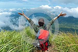 Hiker woman happy feeling freedom good and strong weight victorious facing on the natural mountain.