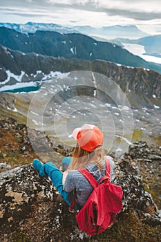 Hiker woman relaxing in mountains of Norway travel hiking outdoor adventure healthy lifestyle