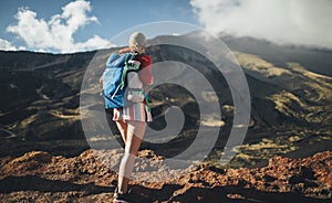 Hiker woman standing on slopes of Mt. Etna , Sicily