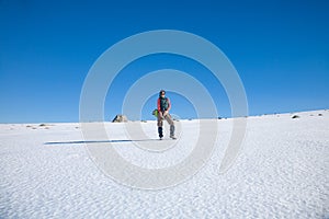 Hiker woman standing in snow