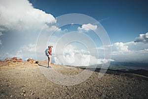 Hiker woman standing on viewpoint