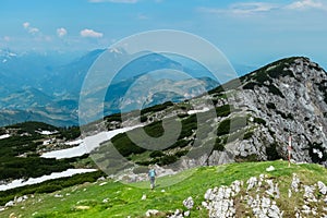 Petzen - Hiker woman on top of Feistritzer Spitze (Hochpetzen), Carinthia, border Austria Slovenia. Alpine meadow photo