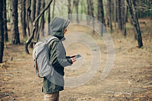 Hiker woman working on digital tablet