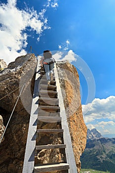 Hiker on wooden staircase photo