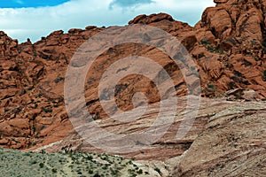 Hikers by the Calico Hills of Red Rock Canyon National Conservation Area, Nevada, USA