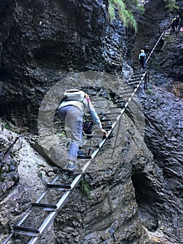 Hikers climb stairs up to the gorge