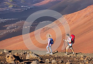 Hikers enjoying walk on amazing mountain trail