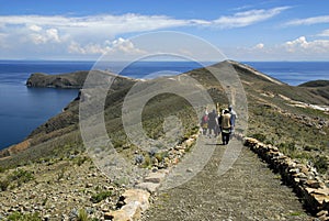 Hikers on Inca Trail on Isla del Sol with Titicaca photo