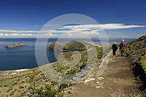 Hikers on Inca Trail on Isla del Sol with Titicaca photo