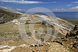 Hikers on Inca Trail on Isla del Sol with Titicaca photo