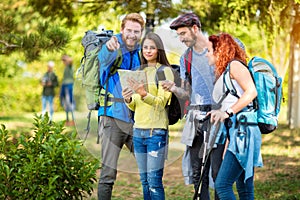 Hikers look at map and compass