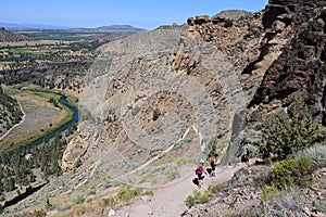 Hikers on Misery Ridge Trail in Smith Rock State Park, Oregon.