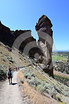 Hikers on Misery Ridge Trail in Smith Rock State Park, Oregon.
