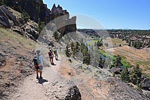 Hikers on Misery Ridge Trail in Smith Rock State Park, Oregon.